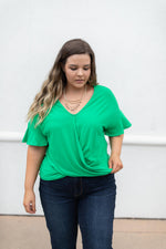 Nice Surprise Surplice Knit Top In Kelly Green